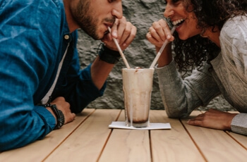 Couple drinking milkshake.